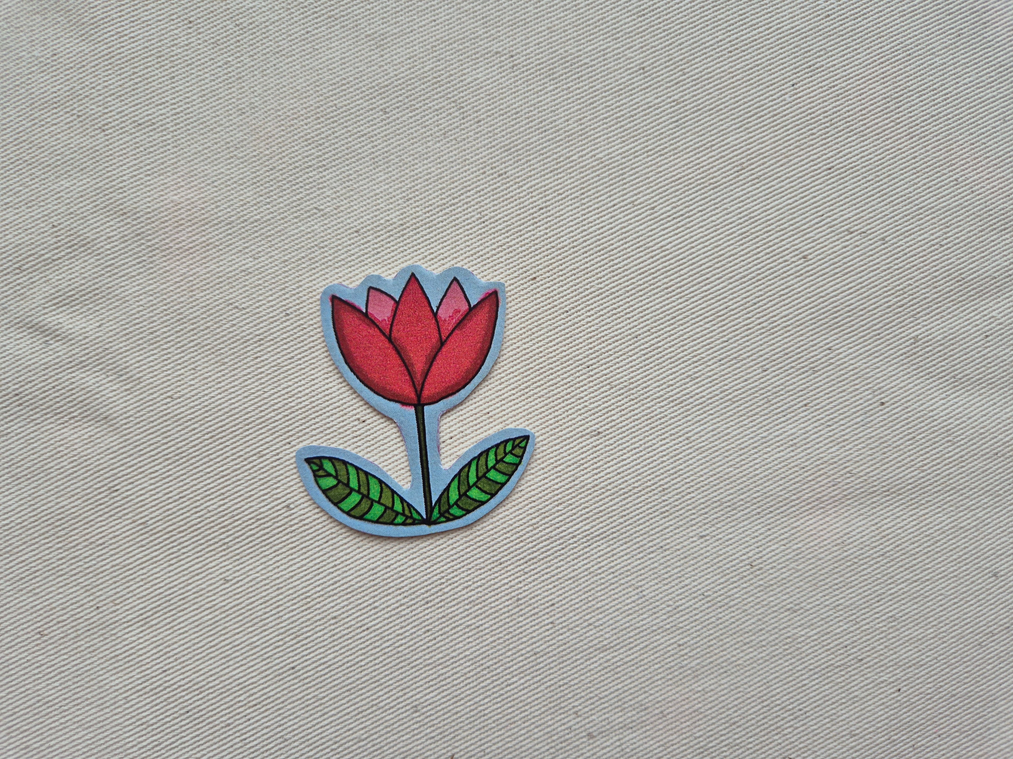 Auto-collant - une fleur rouge